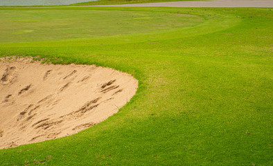 Top view golf court,  beautiful Bunkers sand, putting green and green nature grass, Fairway Rough.