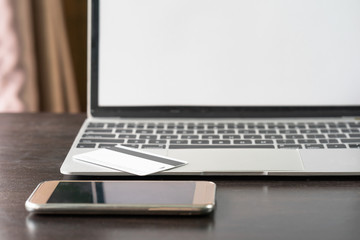 Smartphone, credit card on notebook