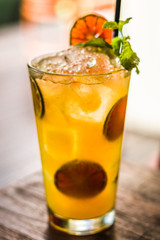 Vodka or rum with homemade falernum, ginger beer and passionfruit in a tall glass