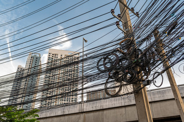 Jumble of overhead electricity and communication cables in Thailand