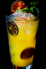 Vodka or rum with homemade falernum, ginger beer and passionfruit in a tall glass