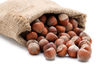Hazelnuts with sack isolated on white background