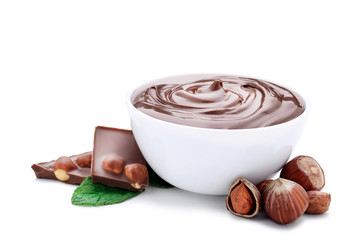 Melted chocolate with hazelnuts and mint leafs isolated on white background