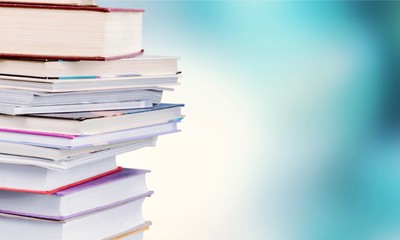 Stack of colorful books on table
