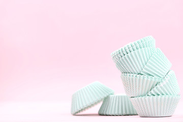 Cupcake cases on pink background