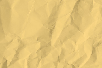 Paper beige color is crumpled and aged. The texture of the surface is old and wrinkled in vintage retro style.