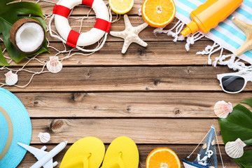 Fashion clothing with seashells and fruits on brown wooden table