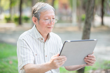 Older man use tablet