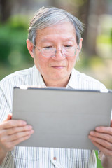 Older man use tablet