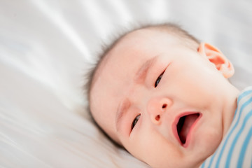 baby lying on the bed