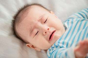 baby lying on the bed