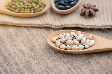 Health food and Eat healthy with legumes in wooden spoon on wooden table. Nutrition high protein diet.