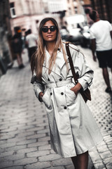 Outdoor fashion portrait of young beautiful stylish woman