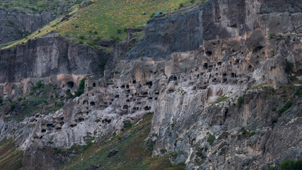 Fototapeta premium View of Vardzia caves. Vardzia is a cave monastery site in southern Georgia, excavated from the slopes of the Erusheti Mountain on the left bank of the Kura River.