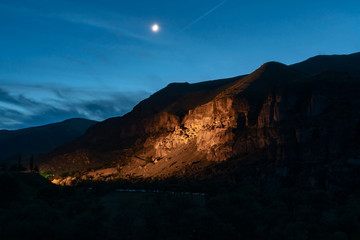 View of Vardzia caves at night. Vardzia is a cave monastery site in southern Georgia, excavated...