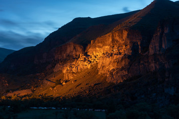 View of Vardzia caves at night. Vardzia is a cave monastery site in southern Georgia, excavated from the slopes of the Erusheti Mountain on the left bank of the Kura River.