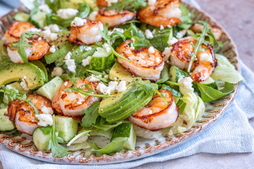 salad with shrimps, avocado, cucumber and feta cheese