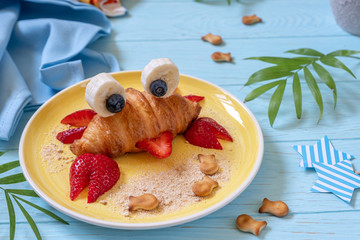 Fun Food for kids. Cute crab croissant with fruit for kids breakfast