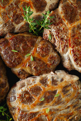 Delicious grilled liver meatballs with buckwheat in a natural casing. Liver patties on the little frying pan served with thyme.