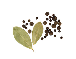 Bay leaf, allspice and pepper isolated on white background
