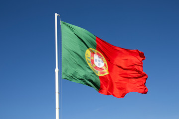 Portugal flag. The national Portuguese flag  waving on a pole. 