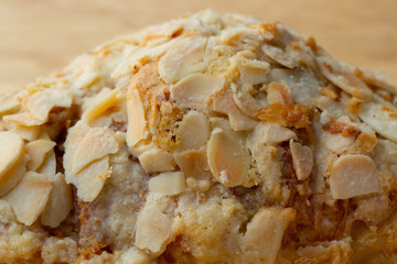 Almond Croissant close up wooden board