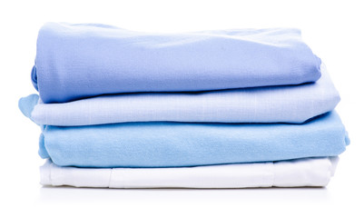 Stack blue folded clothing on white background isolation