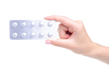 Blister of pills medicine pharmacy in hand on white background isolation