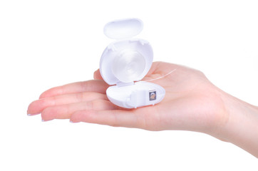 Dental floss plastic case in hand on white background isolation