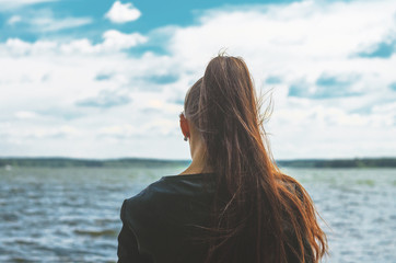 Young woman look at sea horison