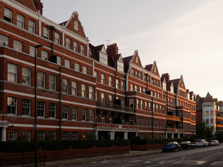 Fototapeta premium Late Victorian mansion blocks at sunset