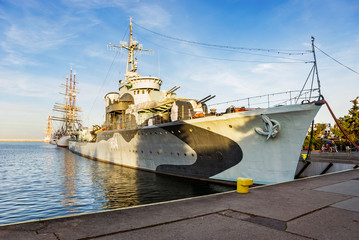 Fototapeta premium Sailboat and ship in harbor Gdynia