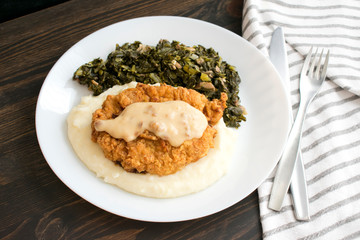 Chicken Fried Steak and Gravy with Mashed Potatoes and Collard Greens