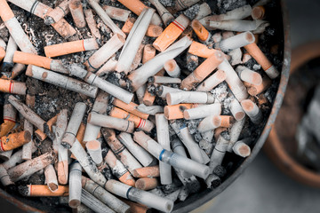 Closed up Cigarette butts, blurred background