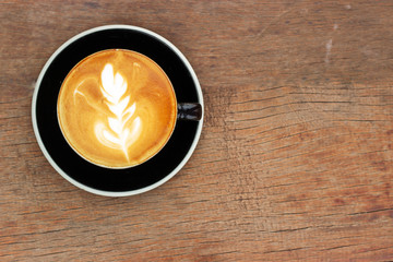 Hot coffee with latte art. Favorite caffeine beverage. Refreshment drink in morning.