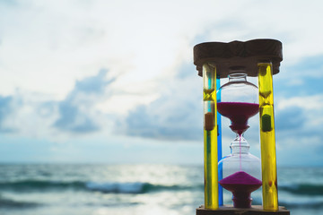 Hourglass, sky background with the sea in Phuket, Thailand.