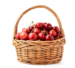 Basket of ripe cherries closeup on a white background. Isolated.