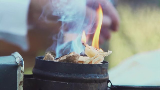 bee-maker beekeeper man working of a smoke pipe beeper smoker device for repelling lifestyle evil bees. slow motion video. apiary. beekeeping concept bee agriculture