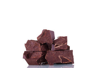Delicious dark chocolate pieces for desserts isolated on white