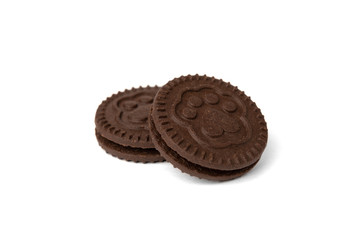Chocolate cookies with milk filling isolated on white background.