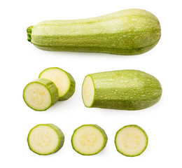 Set of green zucchini, half and pieces on a white. The form of the top.