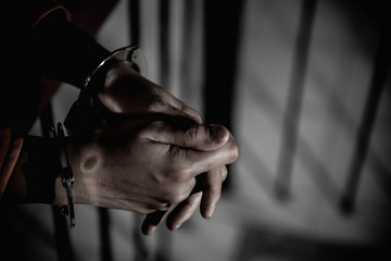 Hands of women desperate to catch the iron prison,prisoner concept,thailand people,Hope to be...