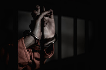 Hands of women desperate to catch the iron prison,prisoner concept,thailand people,Hope to be...