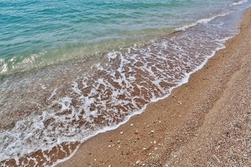 Welle am Strand, Griechenland