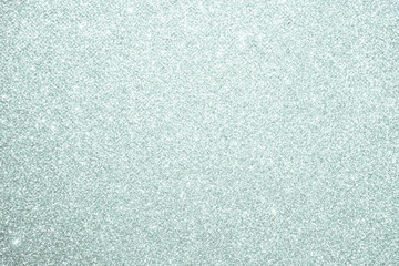 silver Sparkling Lights Festive background with texture. Abstract Christmas twinkled bright bokeh defocused and Falling stars. Winter Card or invitation