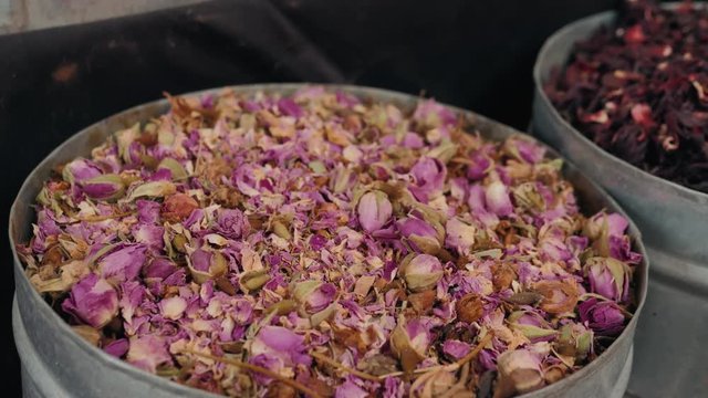 Selection of different arabian spices on a traditional Moroccan market souk in Marrakech, Morocco. A lot of pepper, cardamon, cumin, curry