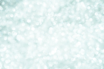 silver Sparkling Lights Festive background with texture. Abstract Christmas twinkled bright bokeh defocused and Falling stars. Winter Card or invitation