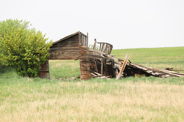 A horizontal photo of a old building fallen down.