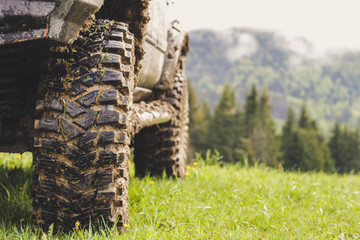 Dirty cars and wheels in the mountains. Swamp on the tires. Trips offroad across Ukraine. View of the Carpathian Mountains. © Yaroslav