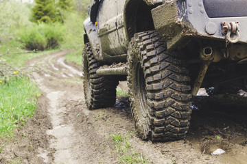 Dirty cars and wheels in the mountains. Swamp on the tires. Trips offroad across Ukraine. View of the Carpathian Mountains.